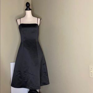 Black satin dress by Jessica McClintock.